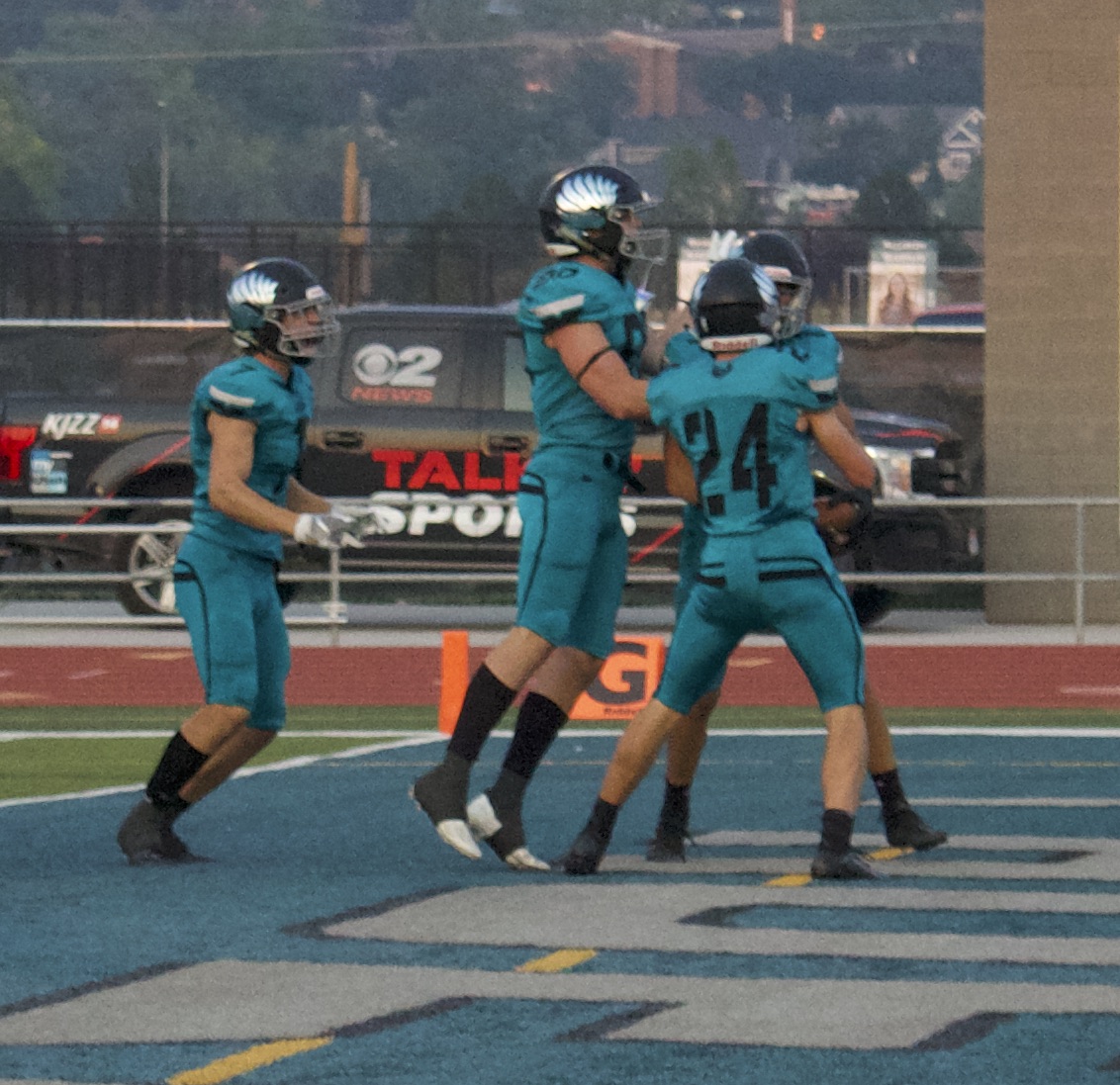 Farmington's Cannon Toone (24) celebrates Charlie Holbrooks' fumble recovery for a touchdown after his initial sack during a high school football game at Farmington High School, Thursday, Aug. 26, 2021 in Farmington.