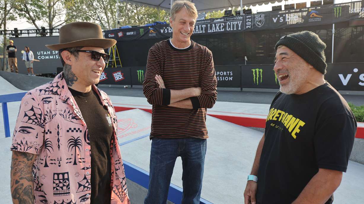 Legendary skaters Christian Hosoi, left, and Steve Caballero, right, share a laugh with Tony Hawk, center, as he hosts a Vert Alert skate event and unveils a new street course at the Utah State Fairpark in Salt Lake City on Friday, Aug. 27, 2021.