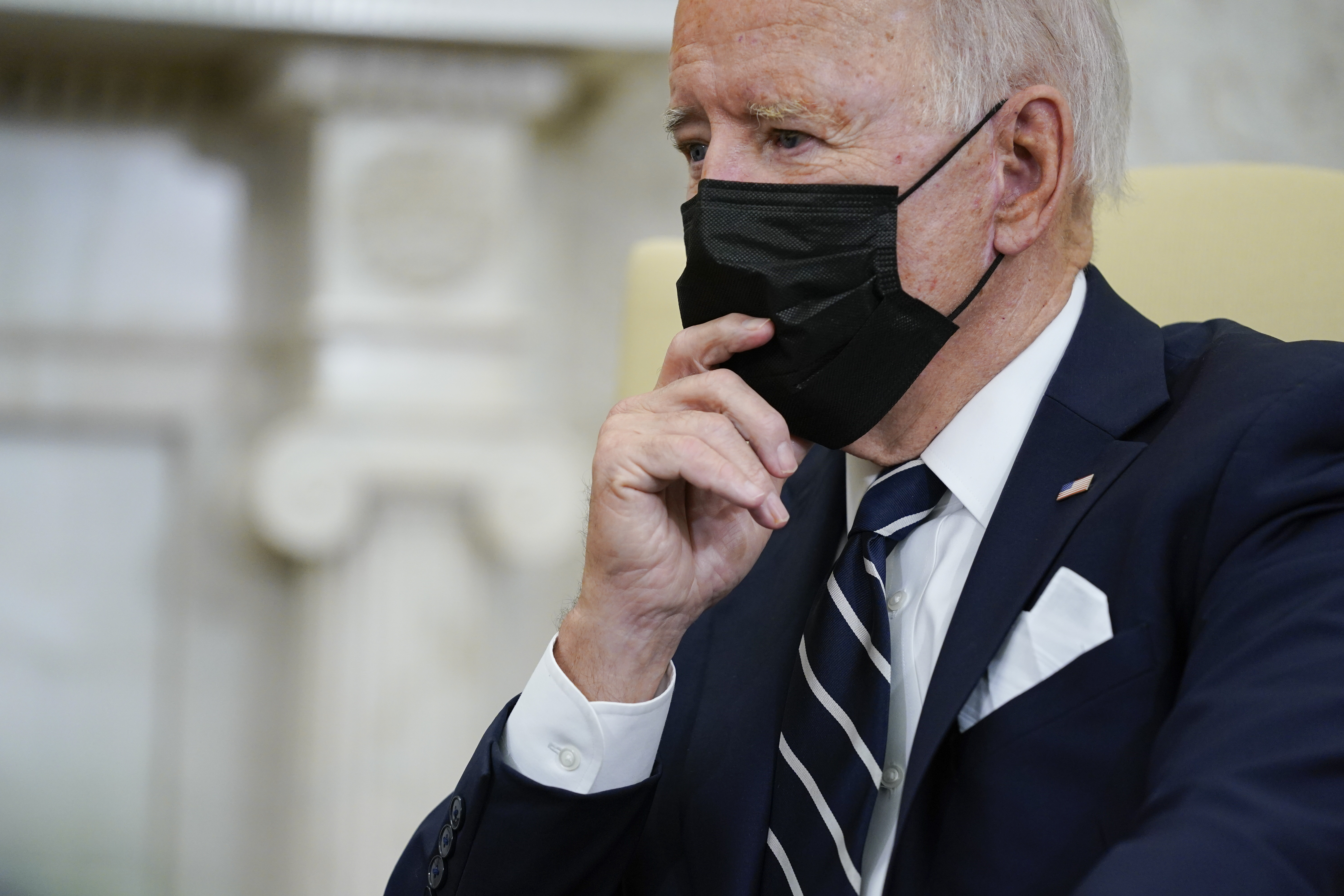 President Joe Biden listens as he meets with Israeli Prime Minister Naftali Bennett in the Oval Office of the White House, Friday in Washington.