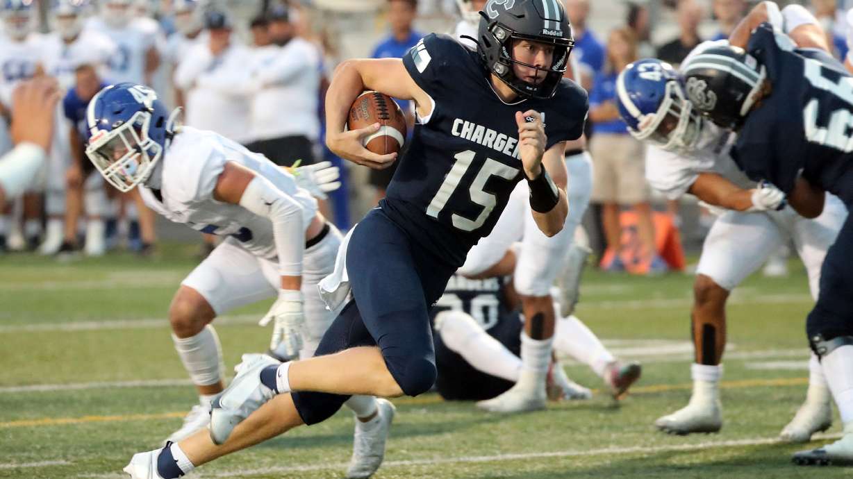 Corner Canyon's Devin Brown runs to the end zone for a touchdown during a high school football game against Bingham at Corner Canyon High School in Sandy on Friday, Aug. 27, 2021.