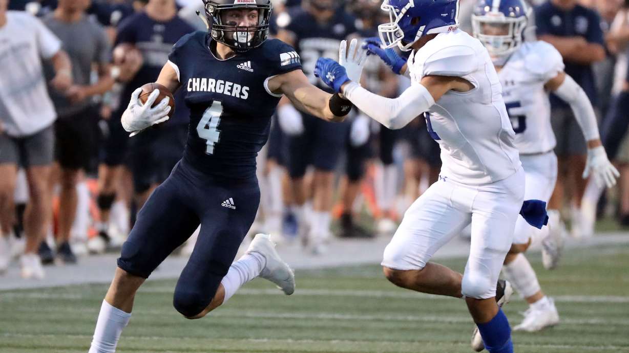 Corner Canyon's Blaze DeGracie pushes Bingham's Semsi Latu off as he runs with the ball during a high school football game at Corner Canyon High School in Draper on Friday, Aug. 27, 2021. Corner Canyon won 35-7.