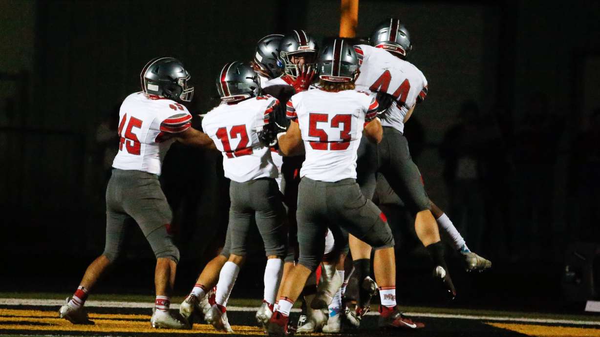 Mountain Ridge players celebrates after a touchdown during the third quarter of a high school football game against Wasatch High on Friday, Aug. 27, 2021, at Wasatch High School in Heber. Mountain Ridge won 40-30.