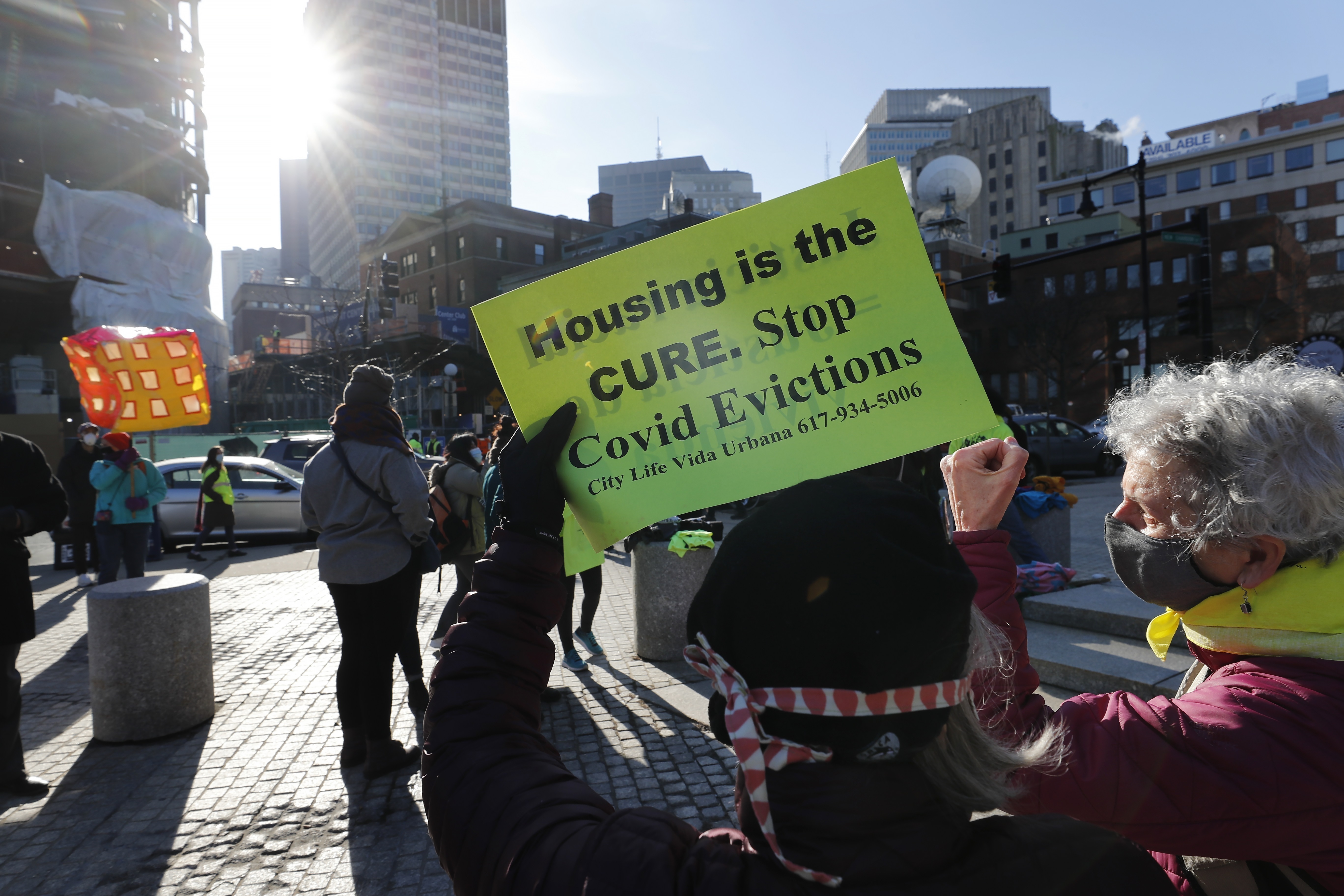 Tenants' rights advocates demonstrate outside the Edward W. Brooke Courthouse in Boston, Jan. 13, 2021. States have begun to ramp up the amount of rental assistance reaching tenants, but there are still millions of families facing eviction who haven't gotten help. 