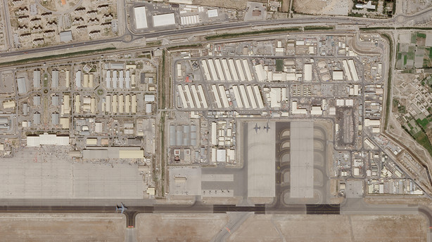 In this satellite photo taken by Planet Labs Inc., the military side of Kabul's international airport is seen as a military flight taxing on the tarmac Saturday.