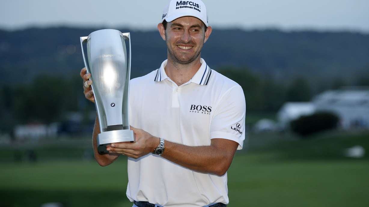Patrick Cantlay holds the trophy after winning the BMW Championship golf tournament, Sunday, Aug. 29, 2021, at Caves Valley Golf Club in Owings Mills, Md.