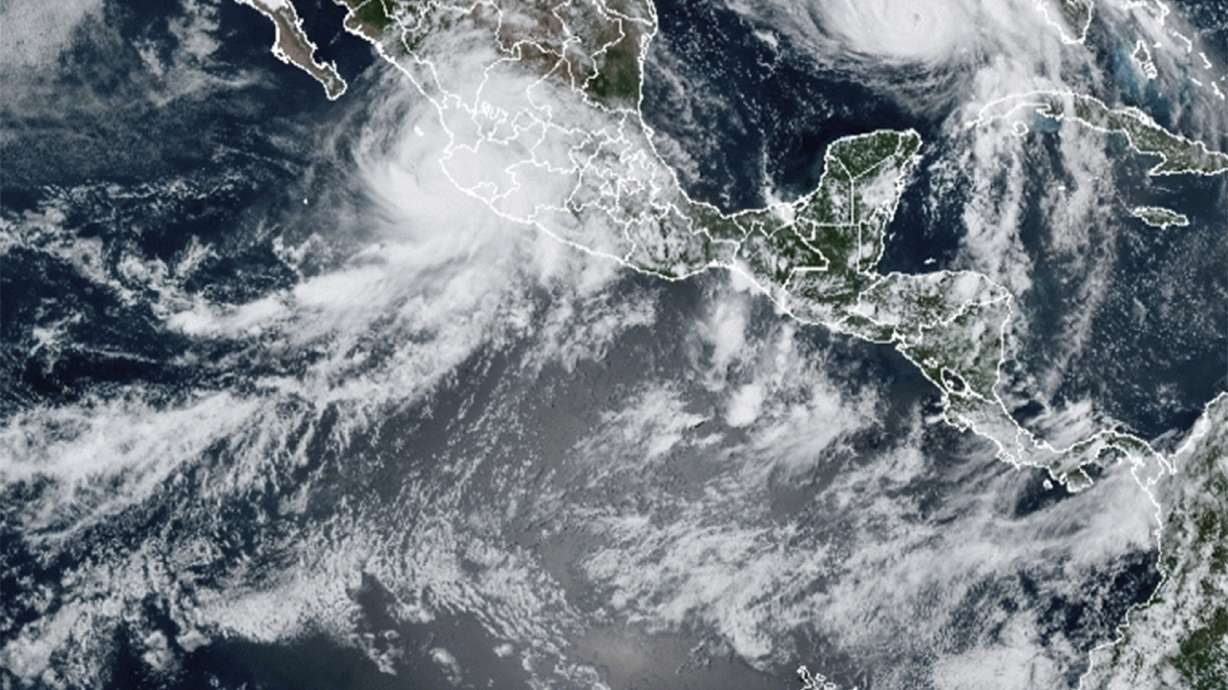 This image provided by the National Oceanic and Atmospheric Administration (NOAA) shows severe weather systems, Hurricane Nora, upper left, and Hurricane Ida, upper right, over the North American continent on Saturday, Aug. 28, 2021. Hurricane Nora is churning northward up Mexico's Pacific Coast toward the narrow Gulf of California, after making a sweep past the Puerto Vallarta area.