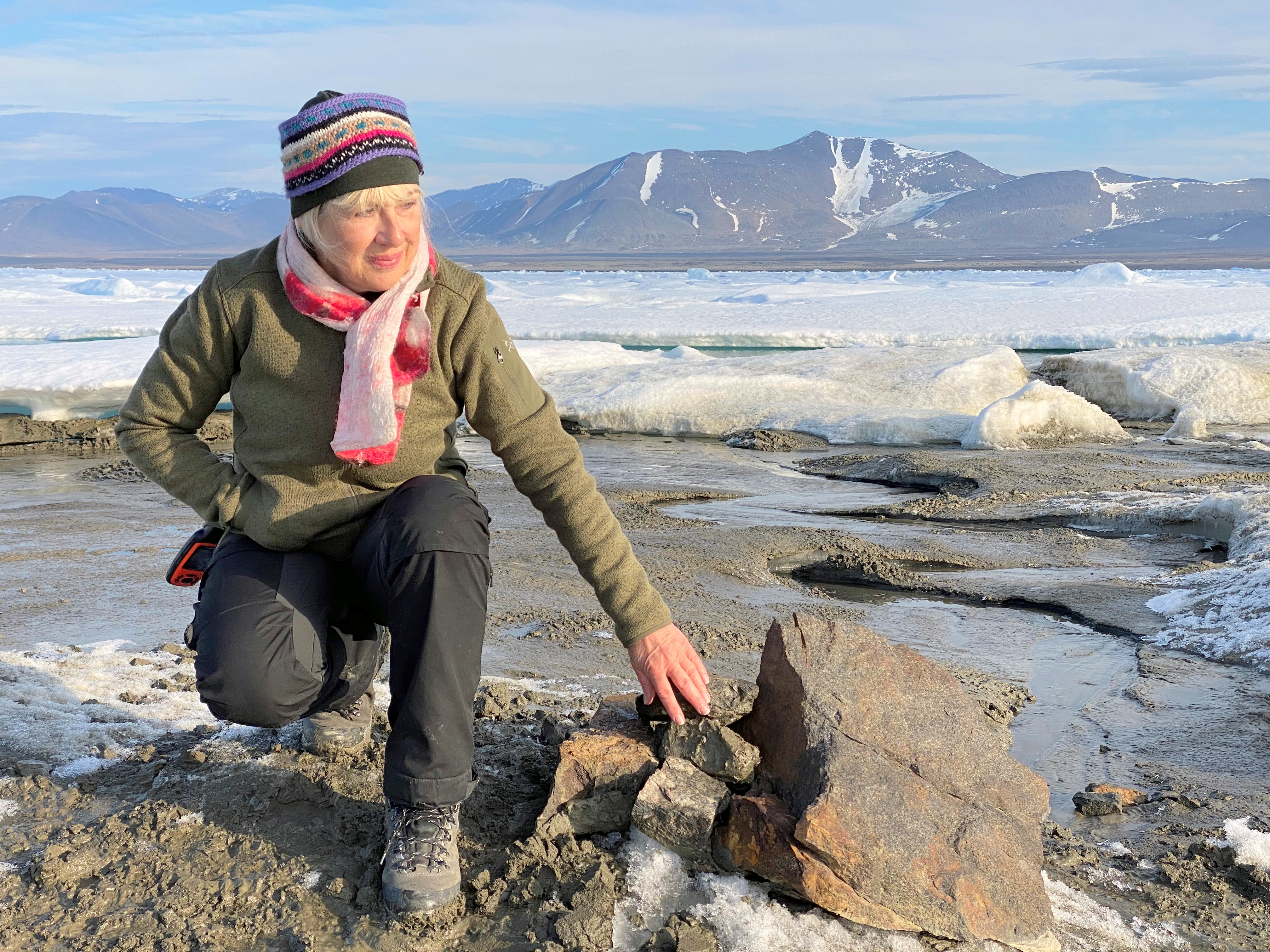 An undated handout image of Swiss entrepreneur Christiane Leister, creator of the Leister Foundation that financed an expedition that discovered a tiny island off the coast of Greenland which they say is the world's northernmost point of land, in front of a cairn in which expedition members left a message with details of their visit.