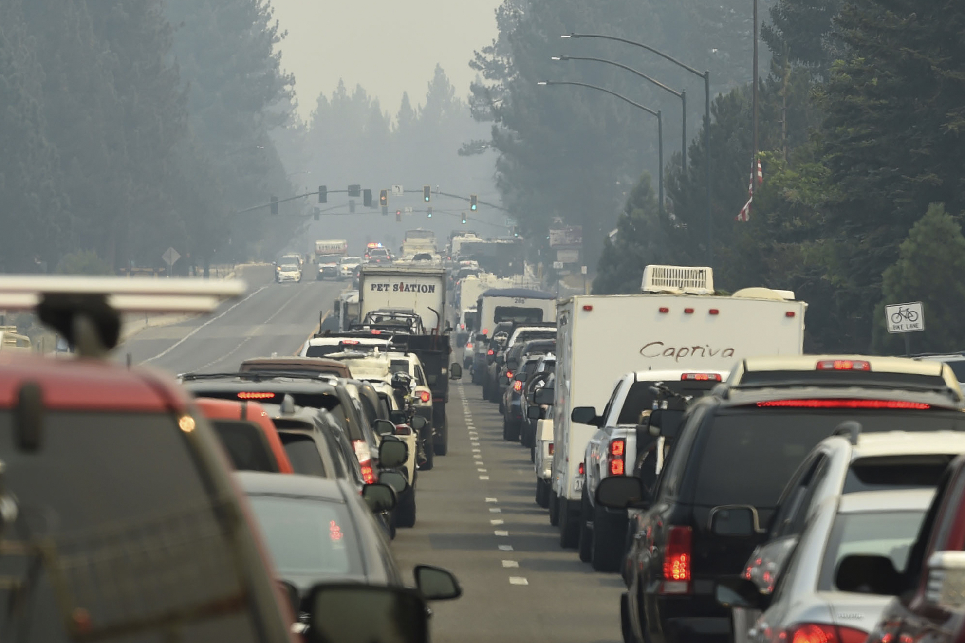 Evacuation traffic backs up in South Lake Tahoe, Calif., as mandatory evacuations are announced due to the Caldor Fire on Monday. Thousands of people rushed to get out as the entire tourist resort city came under evacuation orders.