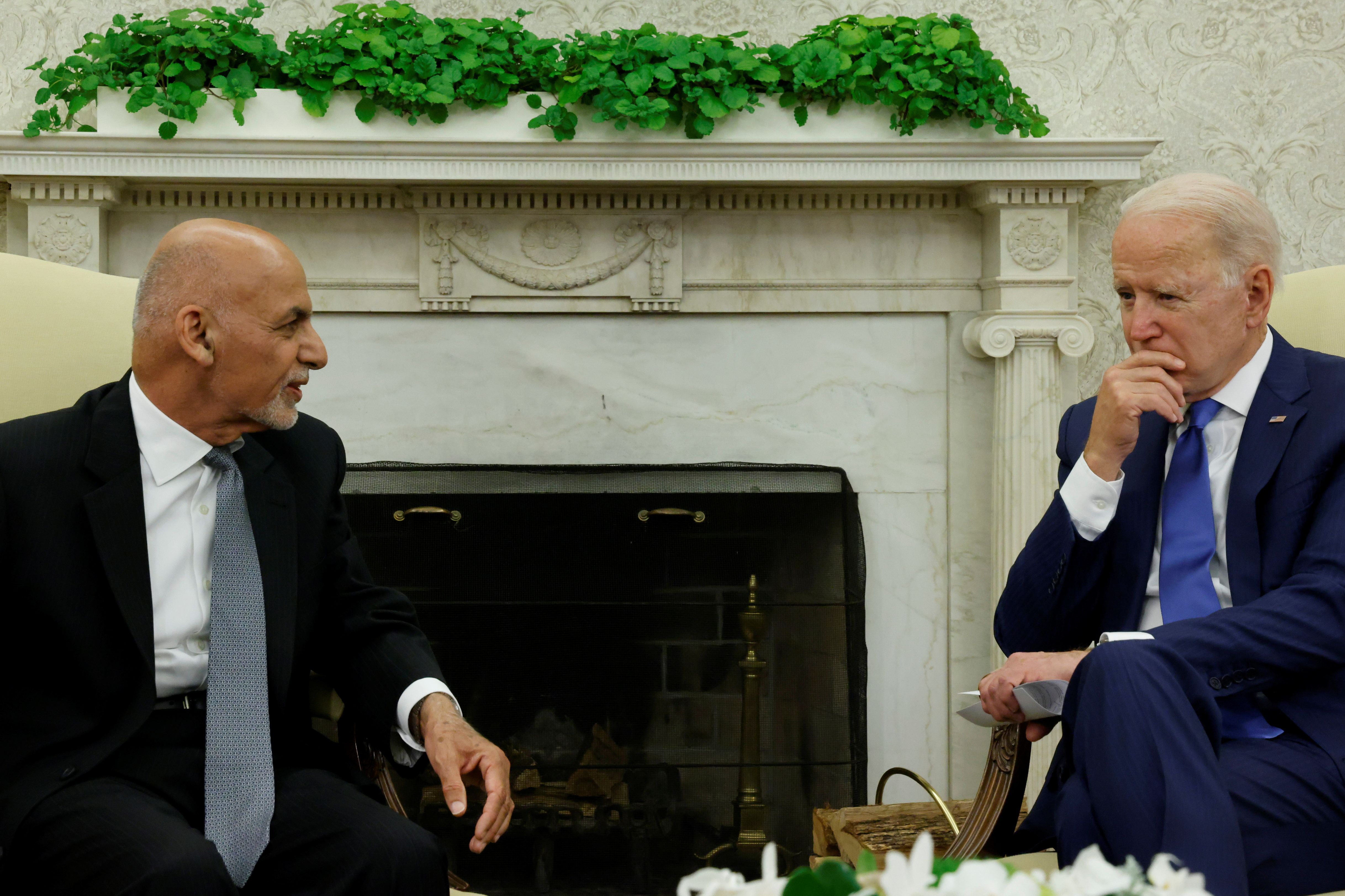 President Joe Biden meets with Afghan President Ashraf Ghani at the White House on June 25. In a call between the leaders, neither Biden nor Ghani appeared aware of or prepared for the immediate danger of the entire country falling to insurgents, a transcript reviewed by Reuters shows.