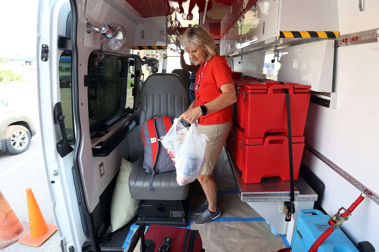 Red Cross volunteer Shelley Smedley loads up a Red Cross van in Murray on Tuesday before heading to Louisiana to help in the aftermath of Hurricane Ida.