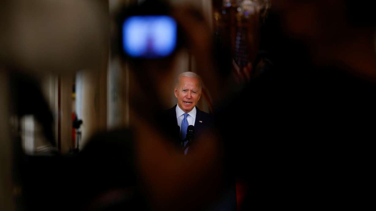 U.S. President Joe Biden is seen in a camera viewfinder as he delivers remarks on Afghanistan during a speech in the State Dining Room at the White House on Tuesday.