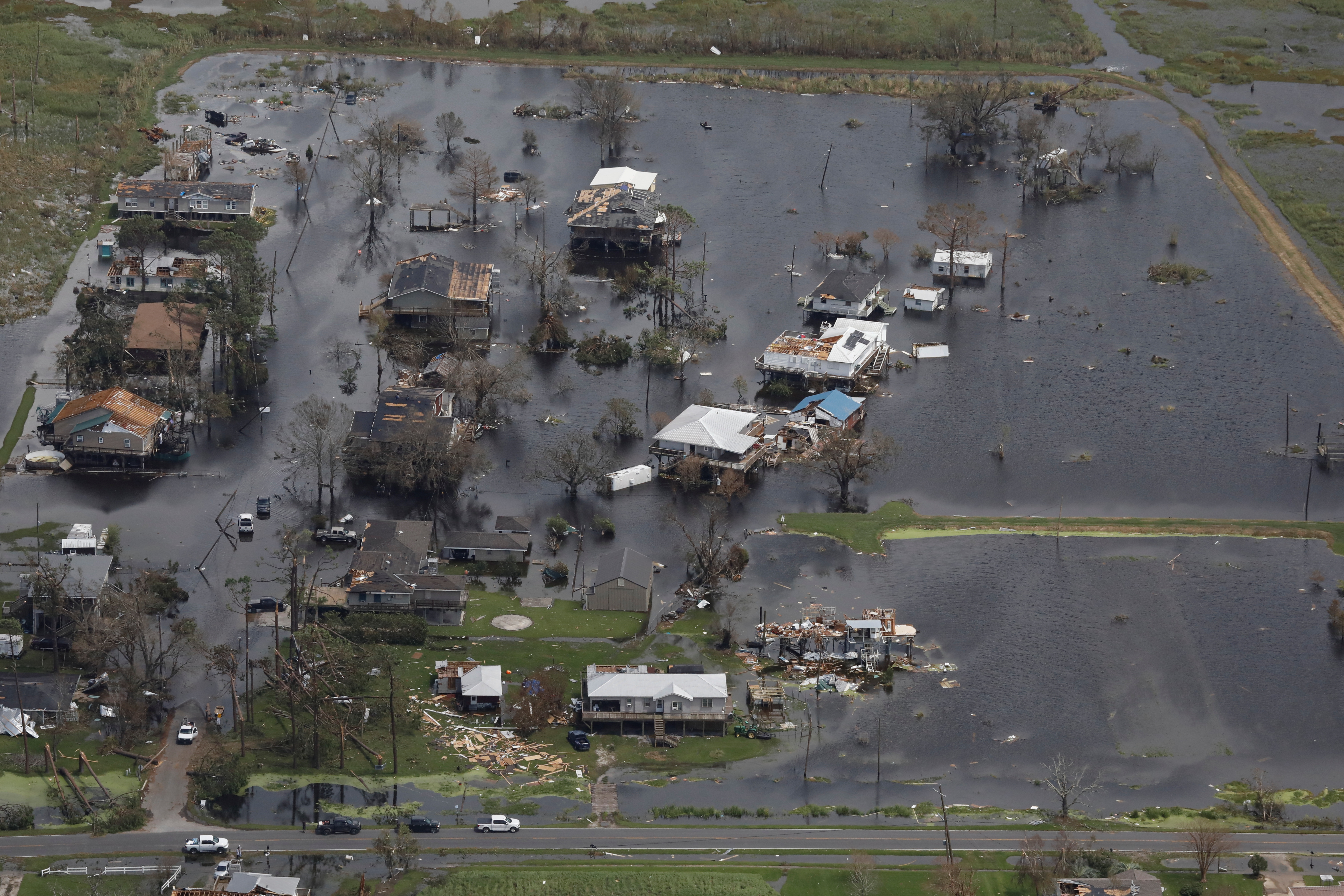 An aerial view shows destroyed houses in a flooded area of Montegut, Louisiana, on Tuesday after Hurricane Ida made landfall. Evacuees who fled Hurricane Ida before the powerful storm hammered southern Louisiana are being urged not to return home yet with power out across much of the state.
