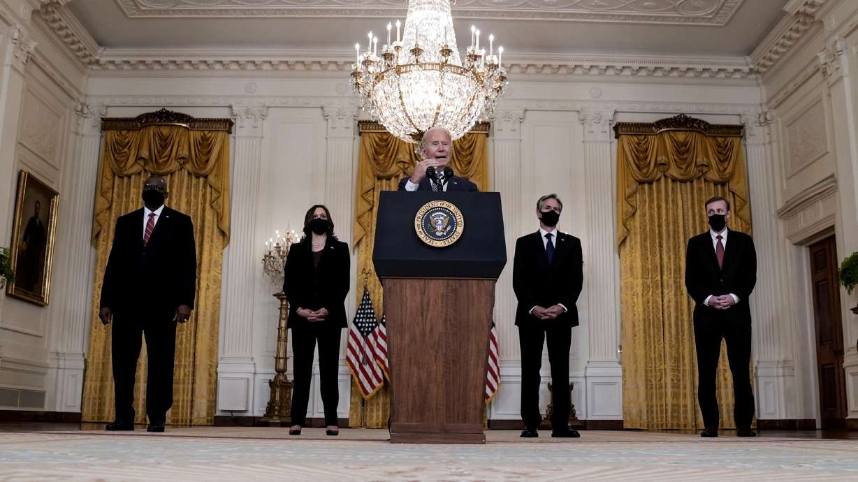 U.S. Defense Secretary Lloyd Austin, Vice President Kamala Harris, Secretary of State Antony Blinken and National Security advisor Jake Sullivan listen as President Joe Biden delivers remarks on evacuation efforts and the ongoing situation in Afghanistan on Aug. 20. The chaotic end to America's longest war has sparked the biggest crisis of Biden's presidency.