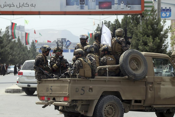 Taliban special force fighters arrive inside the Hamid Karzai International Airport after the U.S. military's withdrawal, in Kabul, Afghanistan, Tuesday. Army Gen. Mark Milley, chairman of the Joint Chiefs, said Wednesday that it's "possible" the U.S. will have to coordinate with the Taliban on future counterterrorism strikes in Afghanistan.