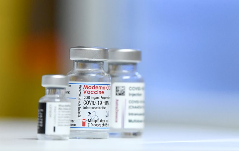Vials of COVID-19 vaccines of Pfizer-BioNTech, Moderna and AstraZeneca are pictured on Feb. 14. Moderna on Wednesday asked the U.S. Food and Drug Administration to allow the use of a third booster dose of its COVID-19 vaccine.