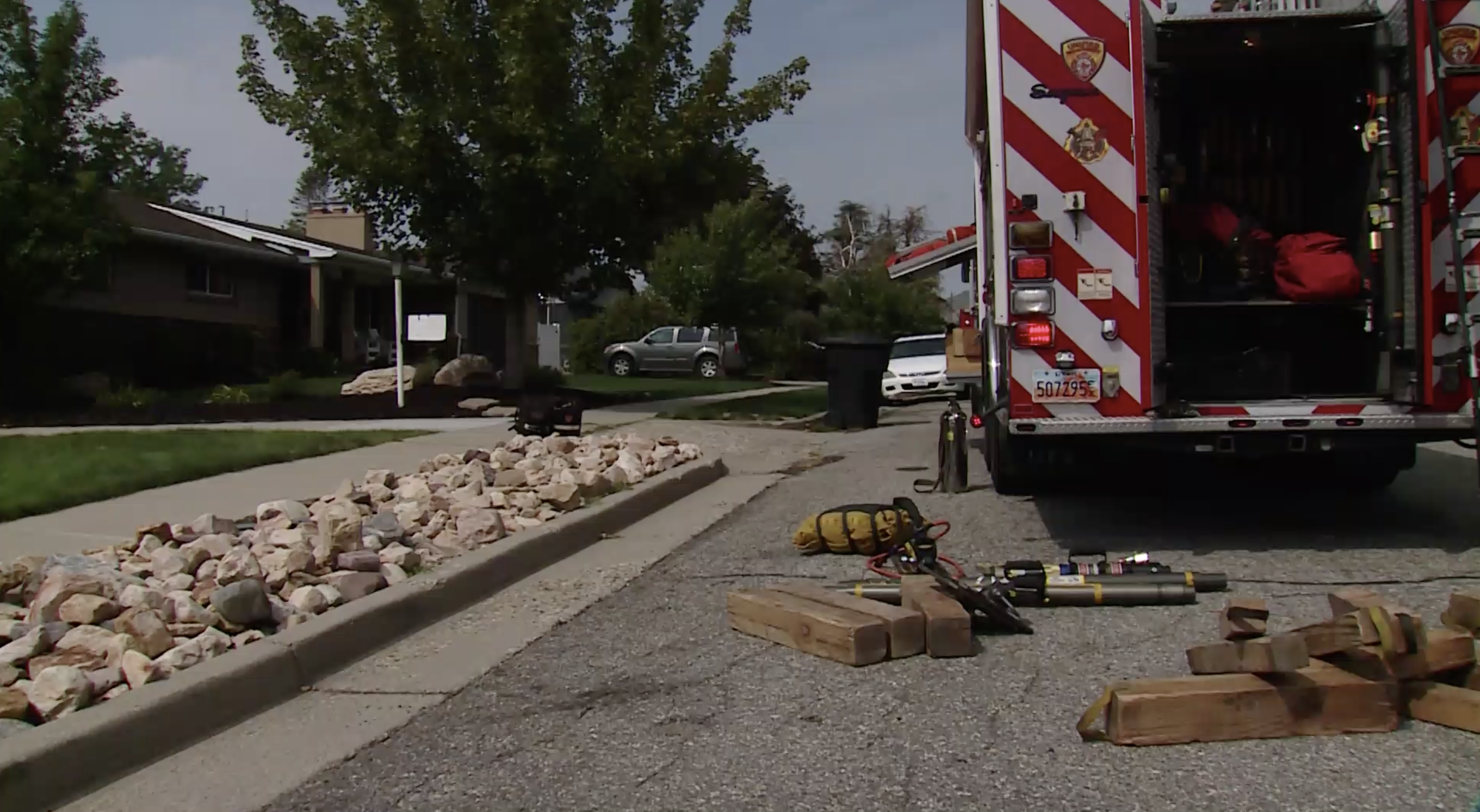 Unified Fire Authority crews clean up after a heavy rescue operation in Millcreek on Wednesday. Crews had to set up airbags and a winch system to get some heavy equipment off of a person who became trapped after the equipment fell off a steep slope while they were using it. 