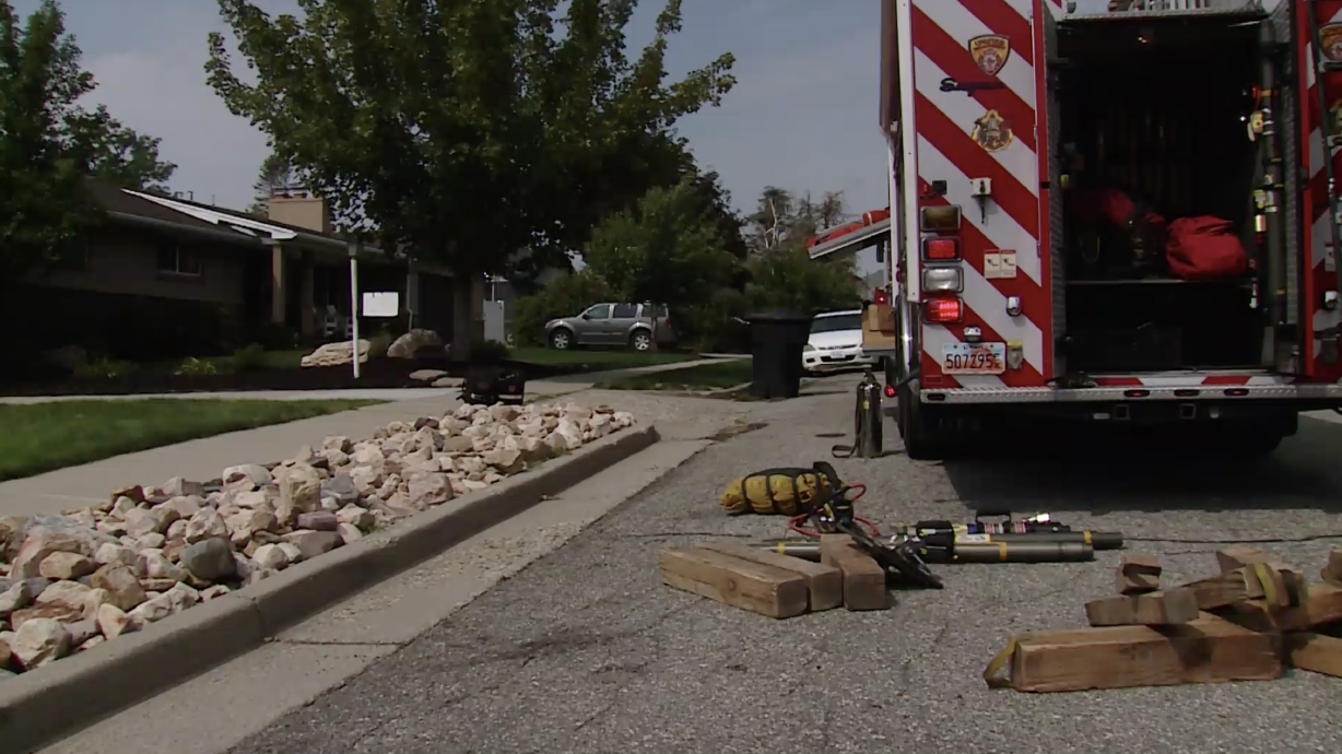Unified Fire Authority crews clean up after a heavy rescue operation in Millcreek on Wednesday. Crews had to set up airbags and a winch system to get some heavy equipment off of a person who became trapped after the equipment fell off a steep slope while they were using it.