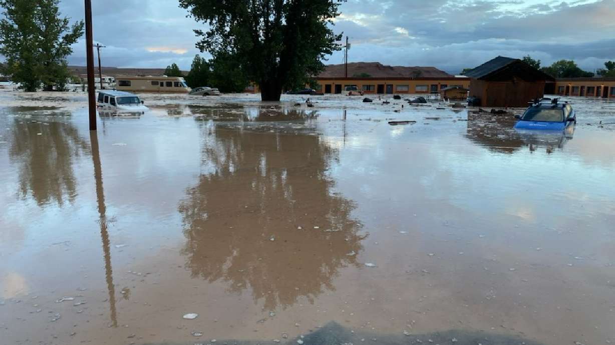 Cars submerged in flood water in Hanksville Wednesday. Officials said homes and businesses were impacted but everyone is accounted for.