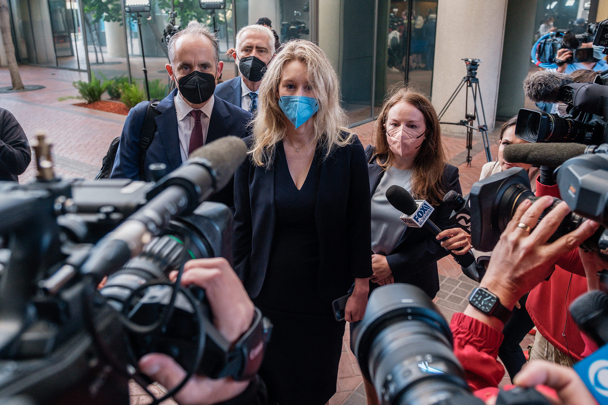 Elizabeth Holmes, the founder and former CEO of blood testing and life sciences company Theranos, arrives for the first day of jury selection in her fraud trial, outside Federal Court in San Jose, California on Tuesday. A jury of seven men and five women has now been selected for Holmes' long-awaited criminal trial.