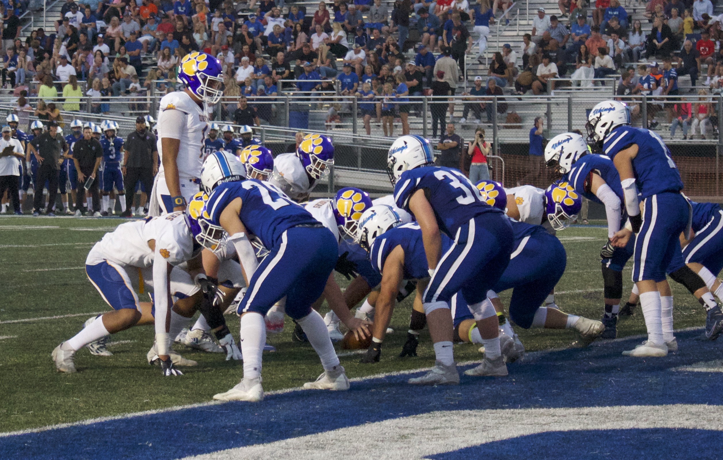 Orem quarterback Chase Tuatagaloa (1) huddles the team during the Tigers' win over the Vikings, Friday, Aug. 27, 2021 in Pleasant Grove.