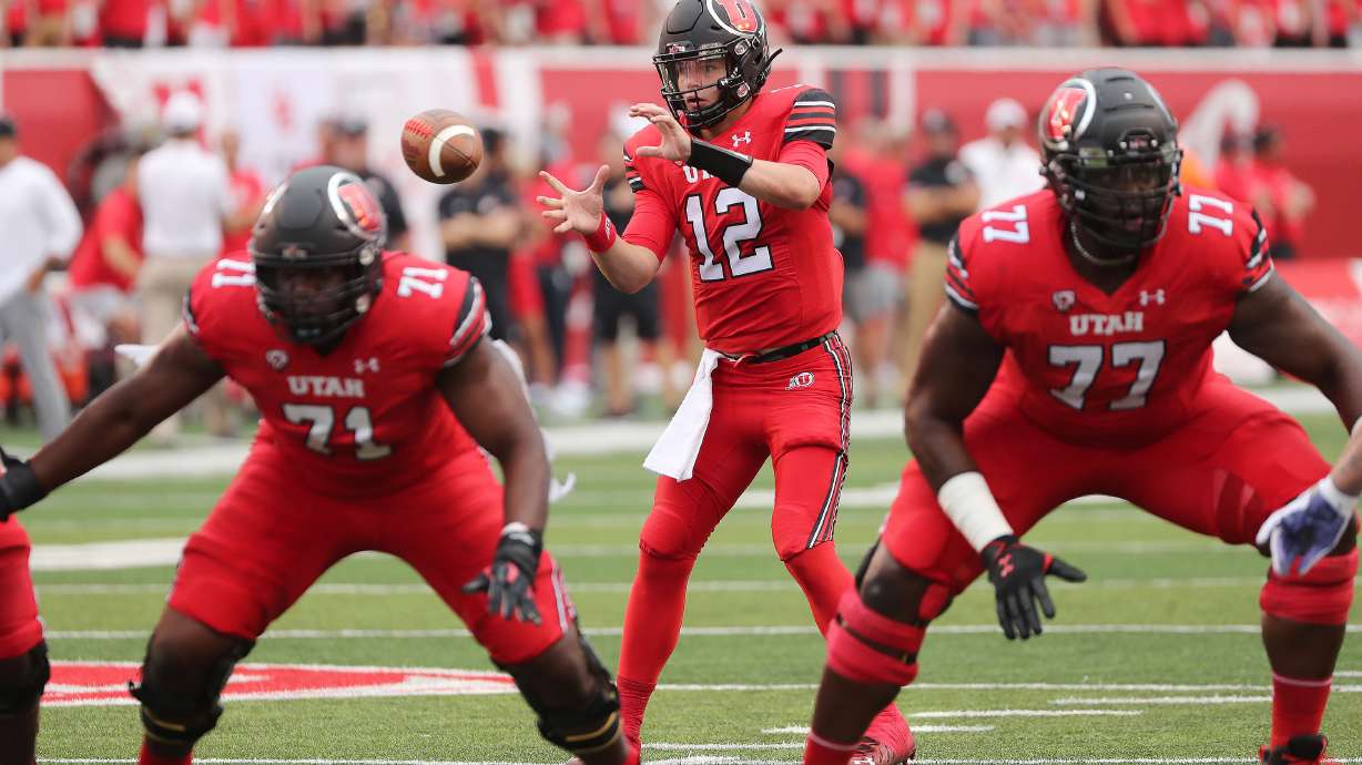 Utah Utes quarterback Charlie Brewer (12) takes a snap during the season opener at Rice-Eccles Stadium in Salt Lake City on Thursday, Sept. 2, 2021.