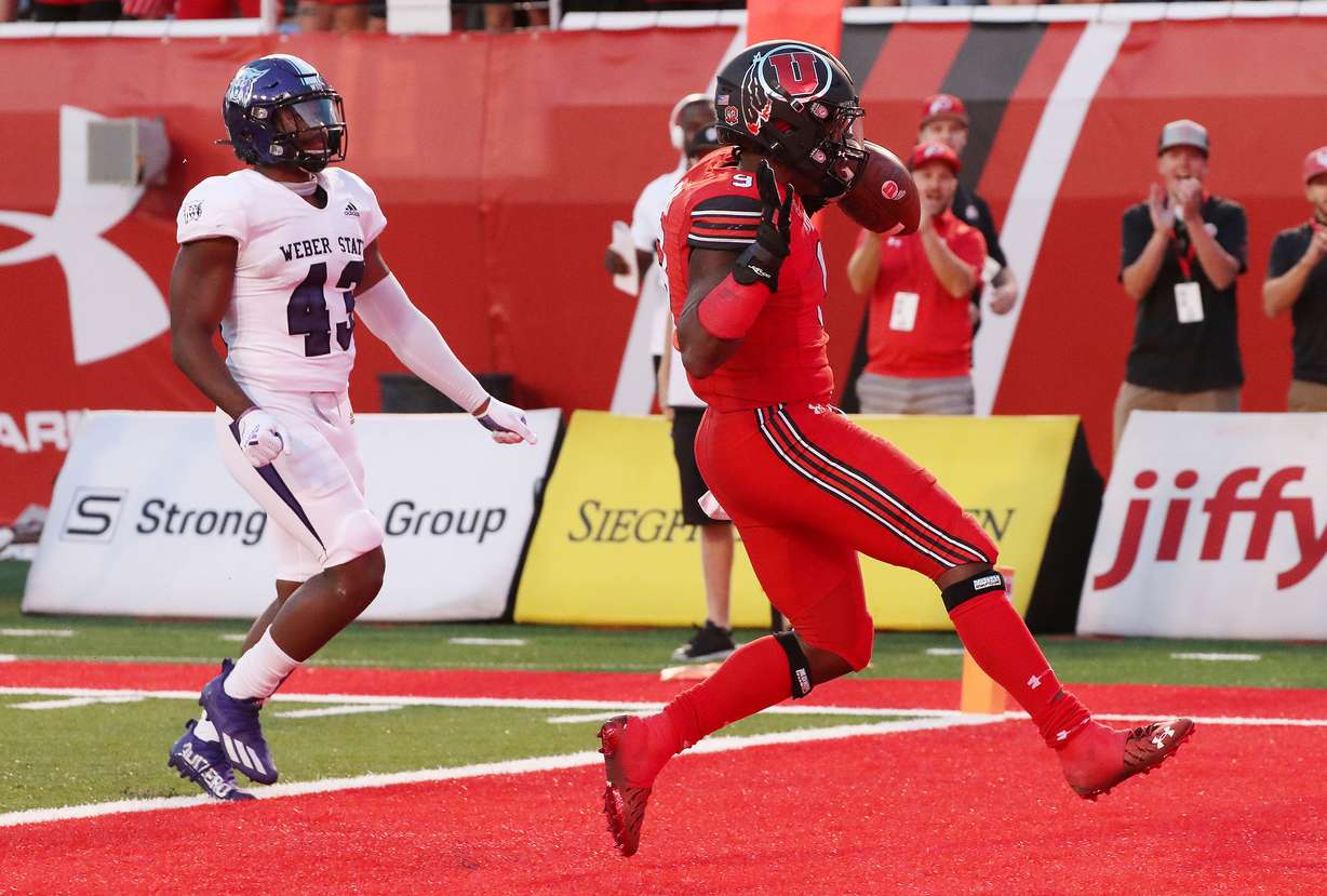 Utah Utes running back Tavion Thomas (9) scores against the Weber State Wildcats during the season opener at Rice-Eccles Stadium in Salt Lake City on Thursday, Sept. 2, 2021.