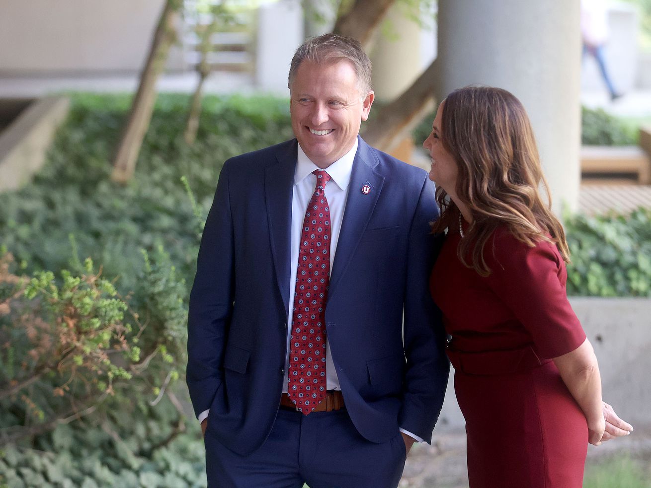 University of Utah President Taylor Randall and his
wife, Janet, laugh during a photoshoot for the University of Utah
outside of the Park Building in Salt Lake City on Aug. 20.