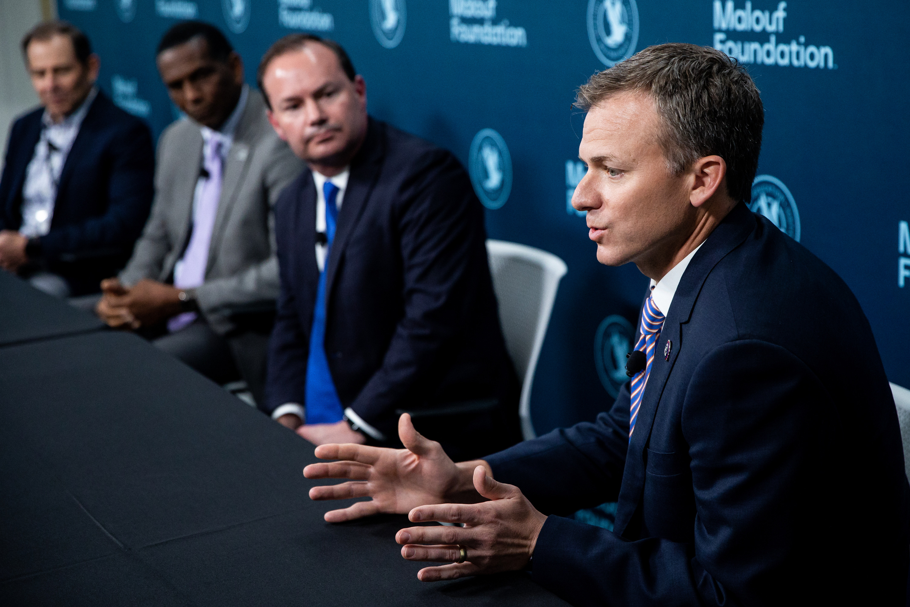 Rep. Blake Moore, right, talks to journalists in Logan on April 17. Moore, R-Utah, announced Friday that he is co-sponsoring the Care for Her Act.