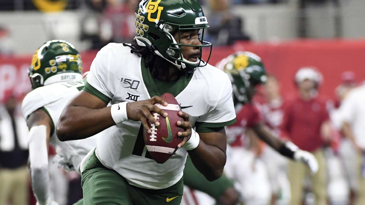 In this Dec. 7, 2019, file photo, Baylor quarterback Gerry Bohanon (11) rolls out to pass against Oklahoma during the first half of an NCAA college football game for the Big 12 Conference championship in Arlington, Texas. Bohanon was named the starting quarterback Monday at South Florida.