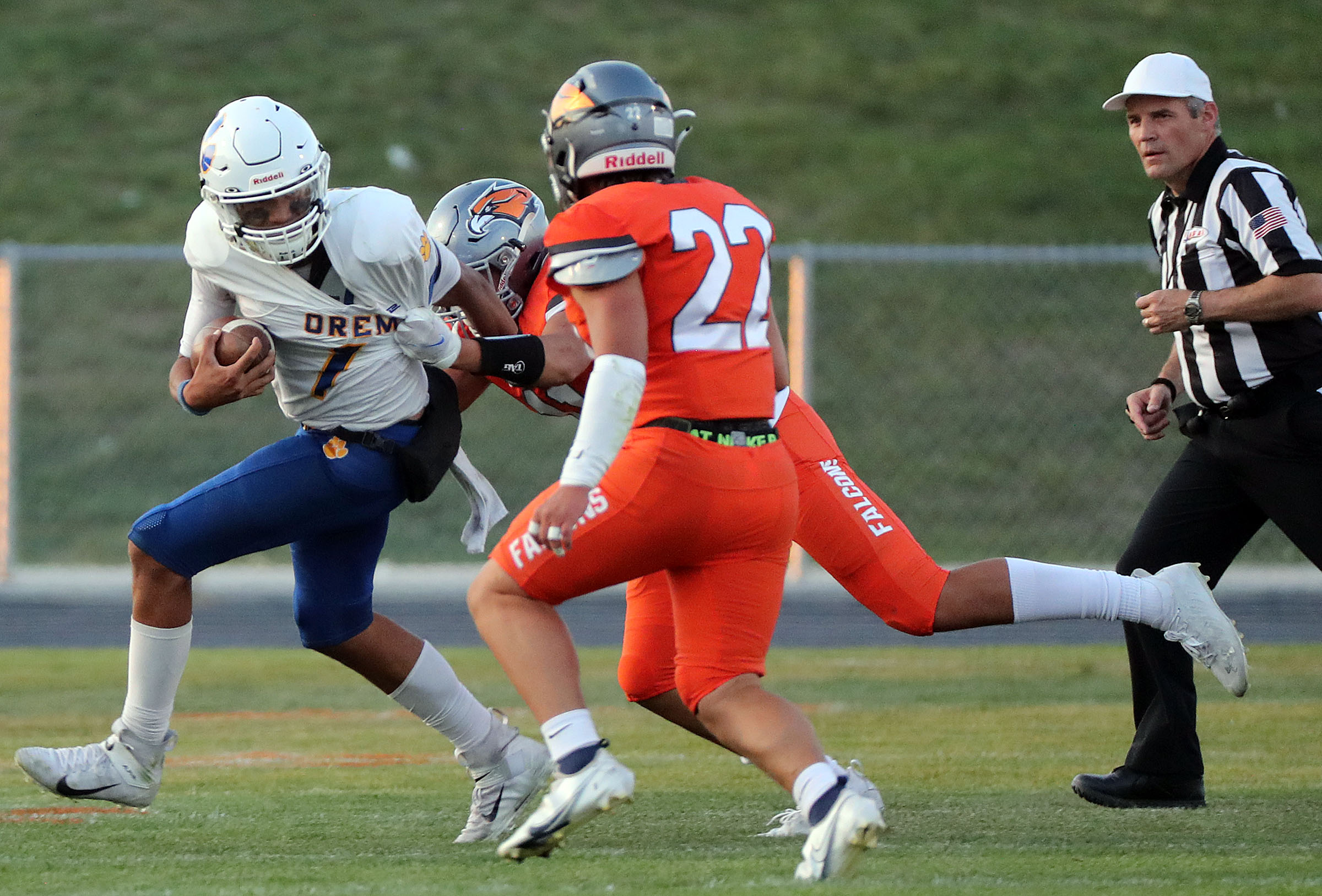 Orem's Chase Tuatagaloa gets tackled by Skyridge's Sione Westover and Tayton Hiatt during a high school football game at Skyridge High School in Lehi on Friday, Sept. 3, 2021. Skyridge won 36-0.