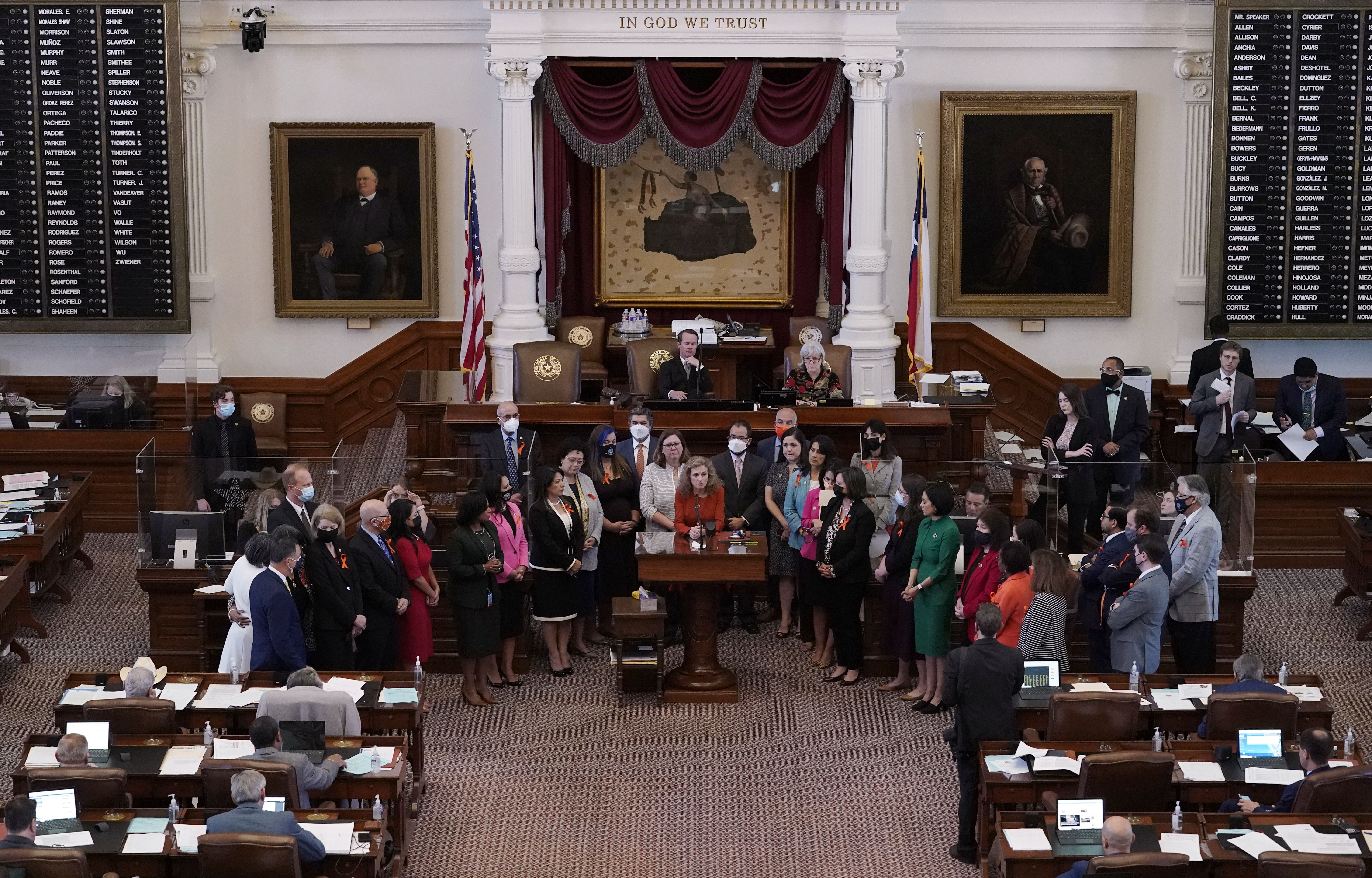 Texas state Rep. Donna Howard, D-Austin, center at lectern, stands with fellow lawmakers in the House Chamber in Austin, Texas, as she opposes a bill introduced that would ban abortions as early as six weeks and allow private citizens to enforce it through civil lawsuits, under a measure given preliminary approval by the Republican-dominated House.