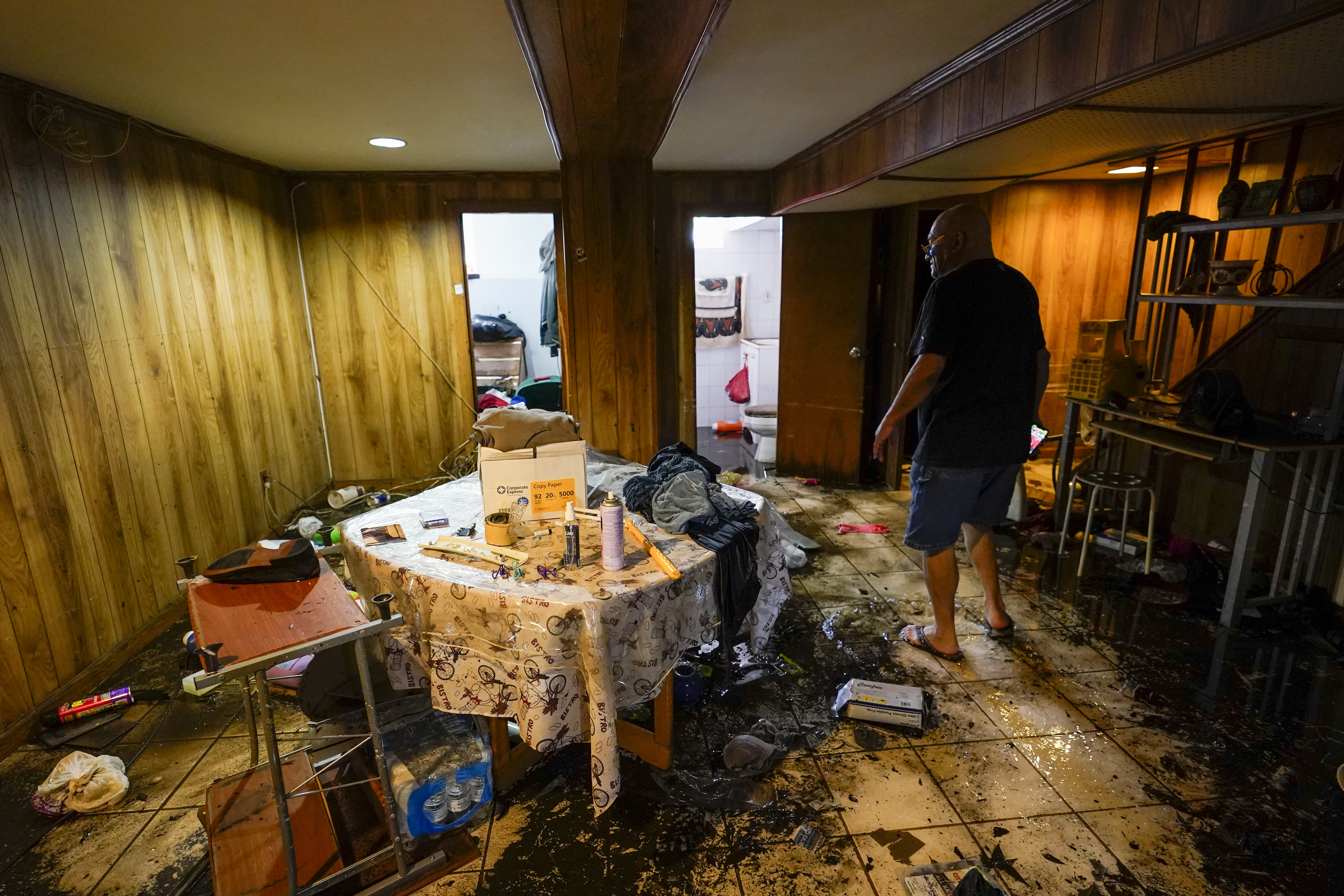 Felix Delapuente, a neighbor fo the home in the Queens borough of New York where some of the occupants died including a 2-year old child, shows the flood damage in his basement, Thursday, Sept. 2, 2021, in New York.