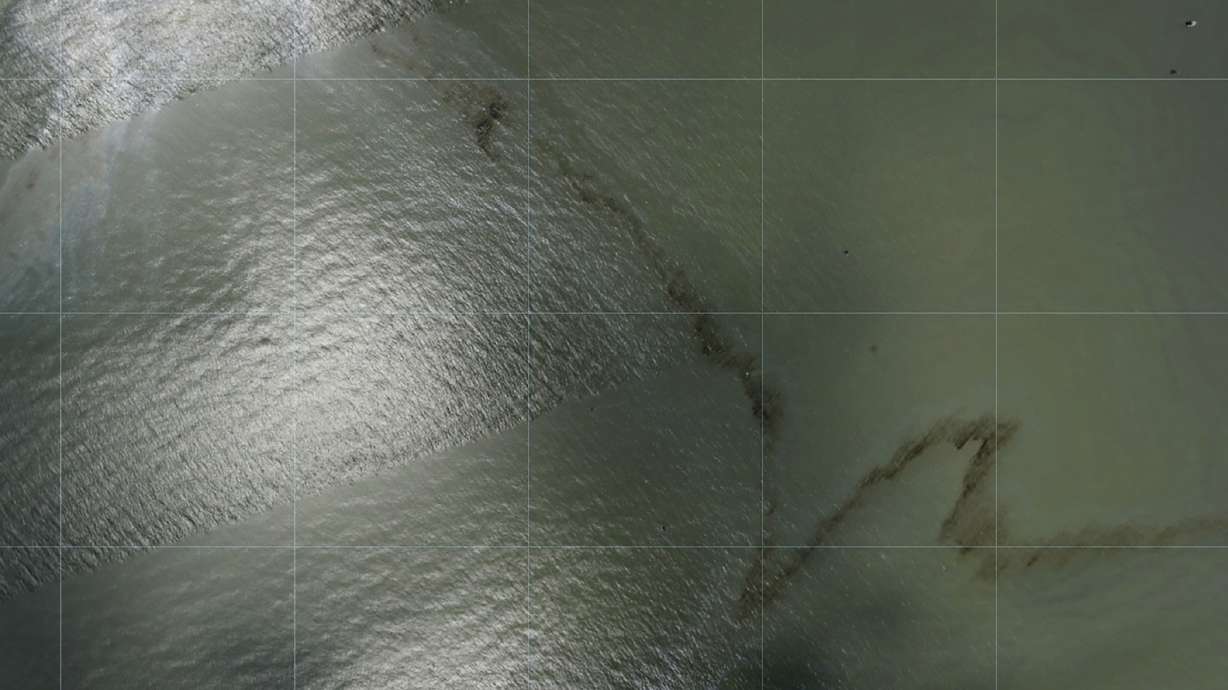 Photos captured by National Oceanic and Atmospheric Administration aircraft Aug. 31 and reviewed by The Associated Press show a mileslong black slick floating in the Gulf of Mexico near a large rig marked with the name Enterprise Offshore Drilling.