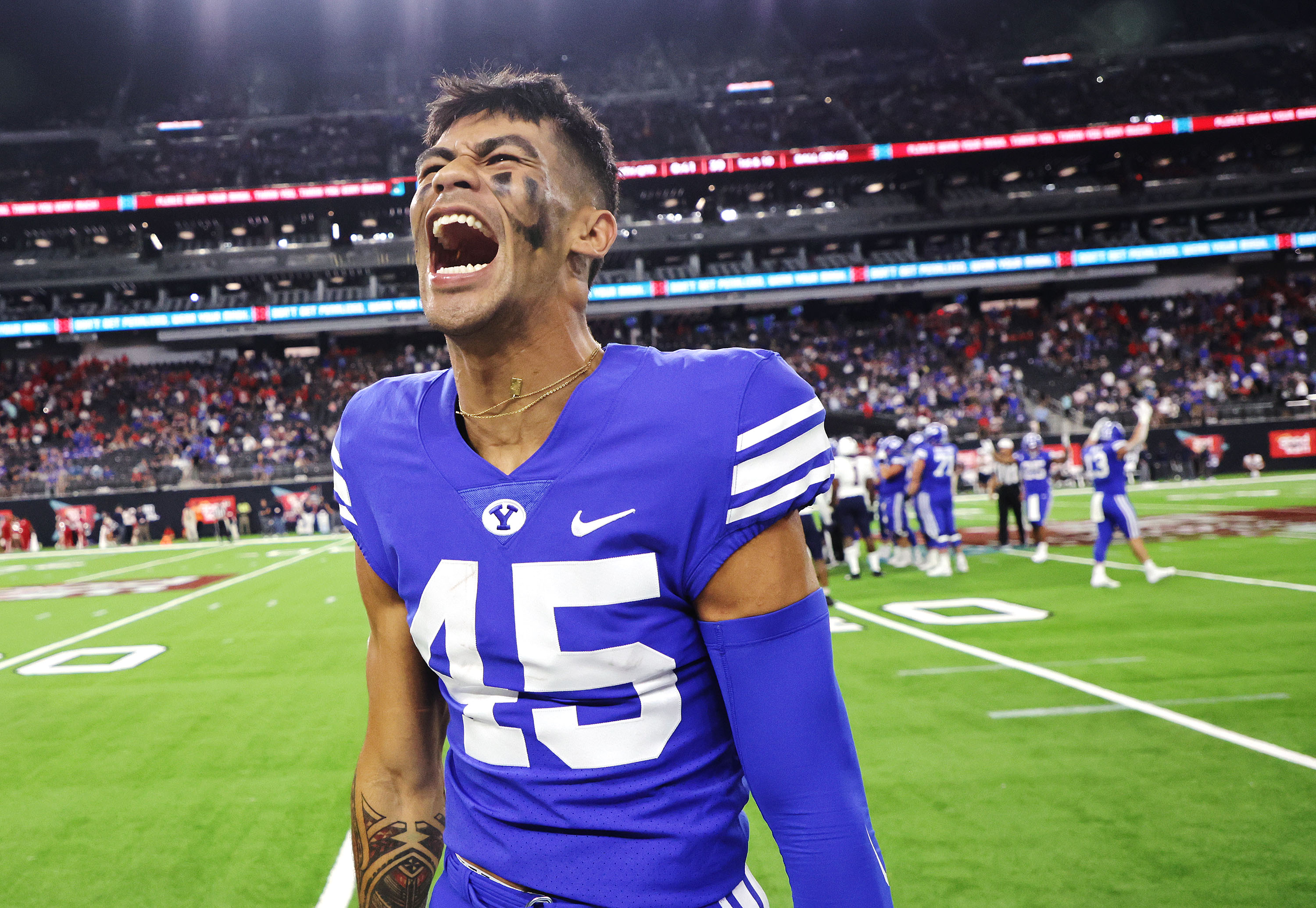 BYU wide receiver Samson Nacua (45) yells after coming off the field during the Vegas Kickoff Classic in Las Vegas on Saturday, Sept. 4, 2021. BYU won 24-16.