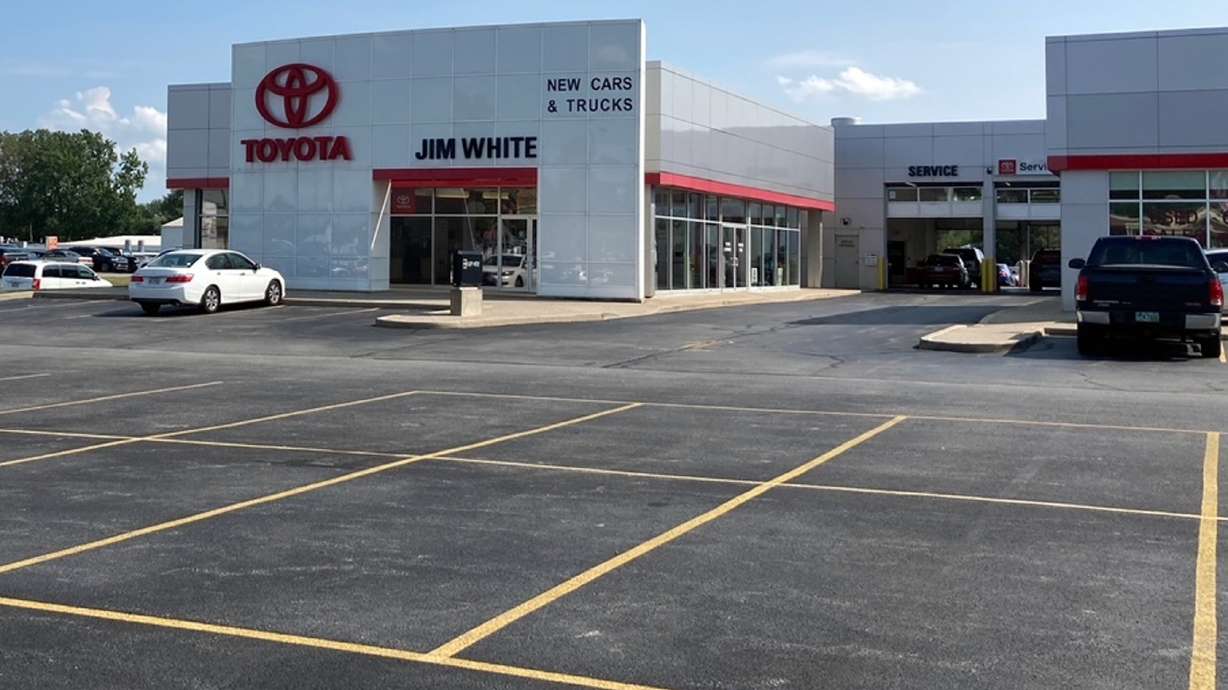 The new car lot at the Jim White Toyota just outside of Toledo, Ohio, is depleted on Aug. 27, with only a few new vehicles available for sale. A global shortage of computer chips has forced automakers to temporarily close factories, limiting production and driving up prices. The coronavirus delta variant is now causing shortages of other parts.