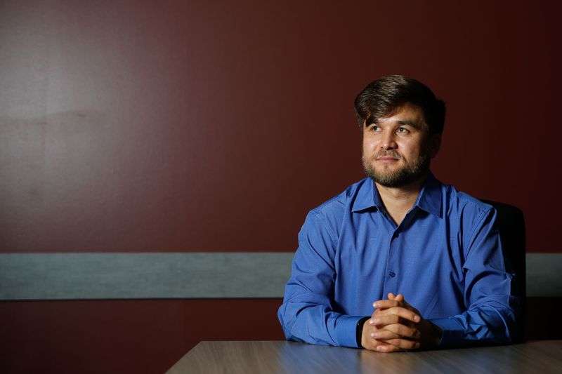 Afghan refugee Azim Kakaie, who fled Kabul, Afghanistan, following the Taliban takeover, poses for a portrait
at Catholic Community Services of Utah in Salt Lake City on
Wednesday. Kakaie, who worked as an air traffic
controller at the Kabul Airport beginning in 2010, also worked with
NATO and the U.S. military.