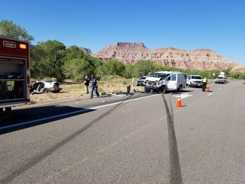 Utah Highway Patrol troopers investigate the crash scene where a man and a woman died on state Route 9 roughly 10 miles outside of Zion National Park Monday morning.