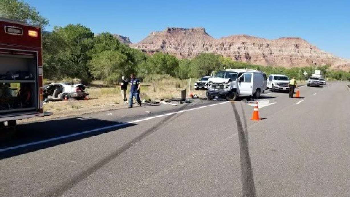 Utah Highway Patrol troopers investigate the crash scene where a man and a woman died on state Route 9 roughly 10 miles outside of Zion National Park Monday morning.