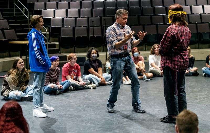 Weber High School theater teacher Mark Daniels, center,
gives instructions for an exercise in his beginning theater class
at the school in Pleasant View, Weber County, on Friday. Daniels has been named 2022 Utah Teacher of the
Year.