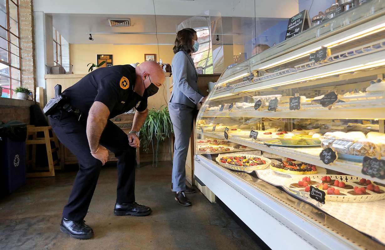 Salt Lake Police Chief Mike Brown, left, and Salt Lake City Erin Mendenhall order pastries at Carlucci's Bakery following a press conference about the city's crime rates on Tuesday.