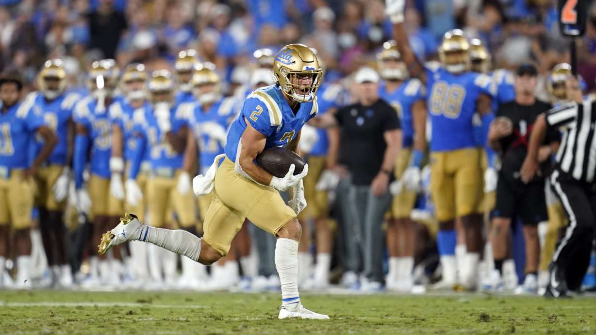 UCLA wide receiver Kyle Philips (2) runs for a touchdown during the second half of an NCAA college football game against LSU Saturday, Sept. 4, 2021, in Pasadena, Calif.