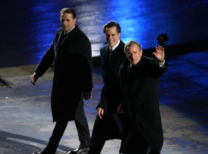 International Olympic Committee President Dr. Jaques
Rogge, Salt Lake Organizing Committee President Mitt Romney and
U.S. President George W. Bush wave to the crowd before moving to
their seats during the Salt Lake 2002 Olympic Winter Games opening
ceremony at Rice-Eccles Stadium on Friday, Feb 8,
2002.