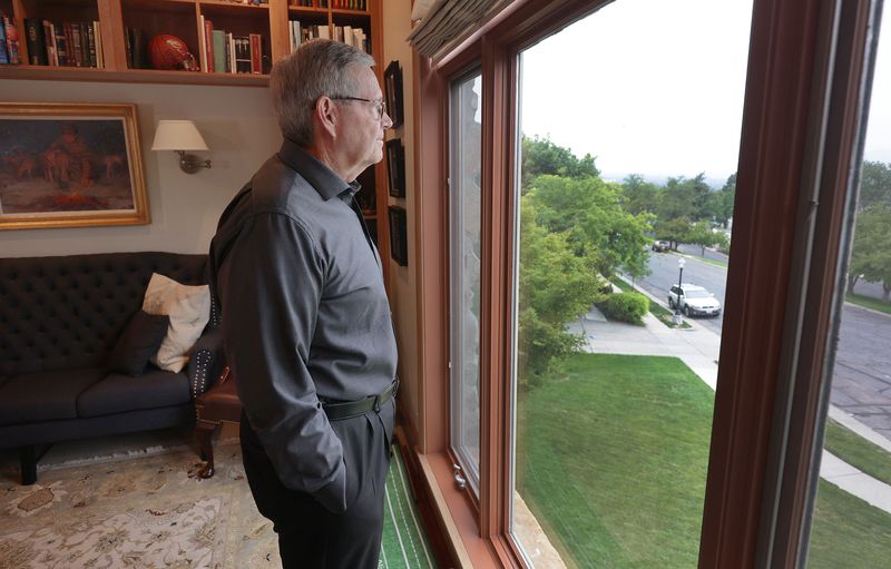 Former Utah Gov. Mike Leavitt looks out of the window
at his home in Salt Lake City on Wednesday, Sept. 1,
2021.
