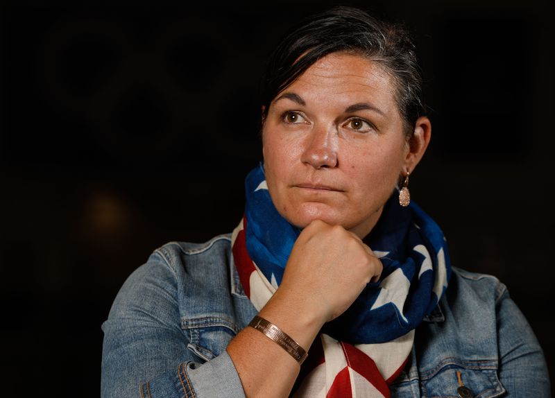 Catherine Raney Norman, Olympic speed skater and Salt
Lake City Committee for the Games bid leader, poses for a portrait
at Utah Olympic Oval in Kearns on Saturday, Aug. 28, 2021, while
wearing a bracelet she wore while competing in the 2002 Winter
Games bearing the name of a New York City firefighter killed in the
9/11 attacks.