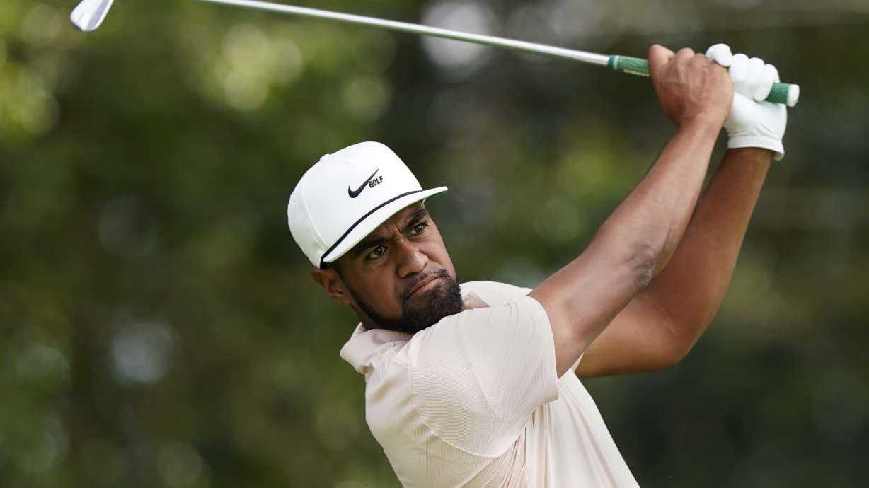 Tony Finau hits from the tee on the second hole during second-round play in the Tour Championship golf tournament at East Lake Golf Club, Sept. 3, 2021, in Atlanta. Finau tied a career low with 62 for a share of the lead at the RBC Canadian Open in Toronto.