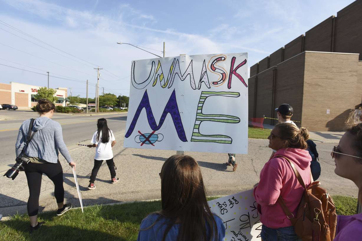 Protesters gather in front of Lakeshore High School, in Stevensville, Mich., on Sept. 7, to protest recent COVID-19 mask mandates.
