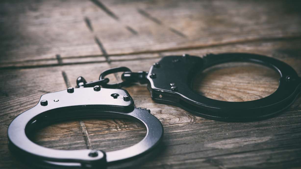 A woman was arrested over the weekend after nearly running over two police officers in Gunnison, claiming she was trying to get away from being forced into sex trafficking in Texas, police say.
