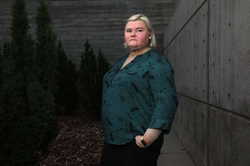 Kirstin Bone poses for a portrait outside of Utah
Valley University, where she is an English professor, in Orem on
Tuesday, Aug. 31, 2021. Bone was 12 at the time of the 9/11
terrorist attacks.
