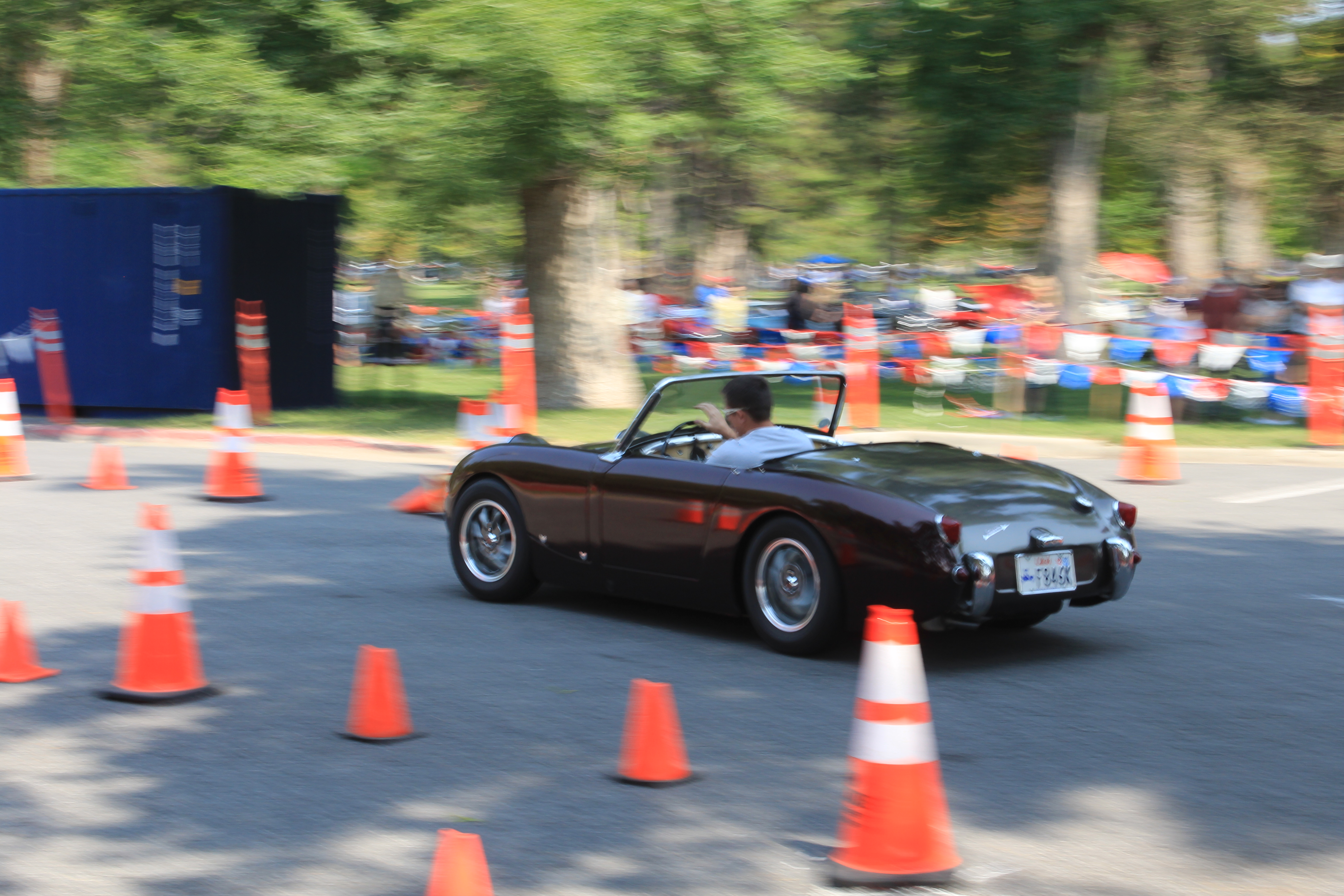 Skyler Sisson works his dad’s 1960 Austin-Healey Sprite through the cones at the British Field Day Autocross in Salt Lake City on Aug. 28, 2021.