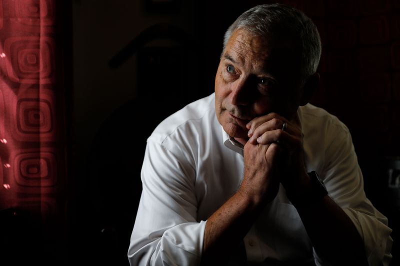 Retired Utah National Guard Lt. Col. Craig Morgan, who
was at the Pentagon on 9/11, looks out of a window as he poses for
a portrait at his house in South Jordan on Sept. 6.